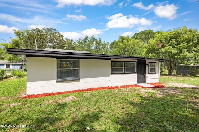 8940 Monroe Ave, Jacksonville, FL 32208 - view of property exterior with a yard
