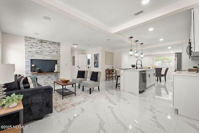 8940 Monroe Ave, Jacksonville, FL 32208 - living room with recessed lighting and light marble finish floors