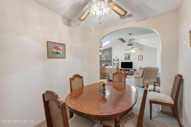 835 Fountain Dr, Fernandina Beach, FL 32034 - dining room featuring ceiling fan, arched walkways, and light carpet