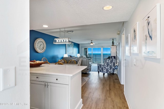 3350 S Fletcher Ave Unit C5, Fernandina Beach, FL 32034 - kitchen featuring light countertops, ceiling fan, a textured ceiling, light wood-style flooring, and recessed lighting