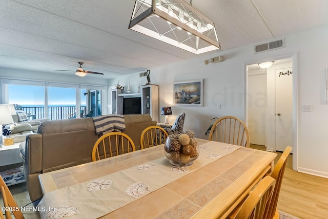 3350 S Fletcher Ave Unit C5, Fernandina Beach, FL 32034 - dining room with light wood-style flooring and a ceiling fan
