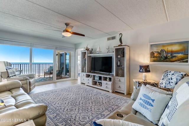 3350 S Fletcher Ave Unit C5, Fernandina Beach, FL 32034 - living room featuring wood finished floors, a ceiling fan, and a textured ceiling