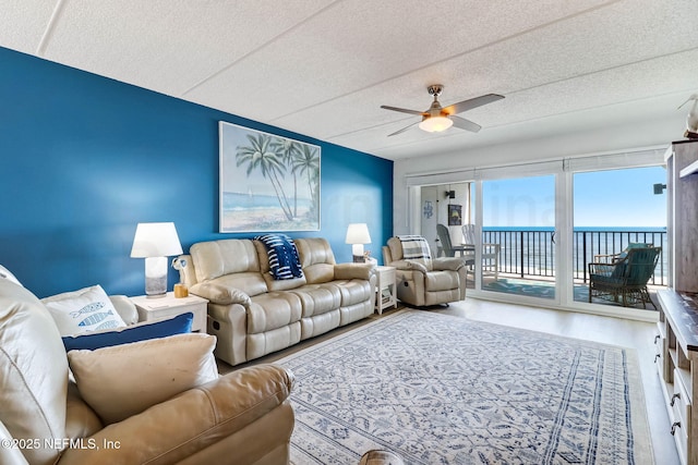 3350 S Fletcher Ave Unit C5, Fernandina Beach, FL 32034 - living room with a ceiling fan, a water view, wood finished floors, and a textured ceiling