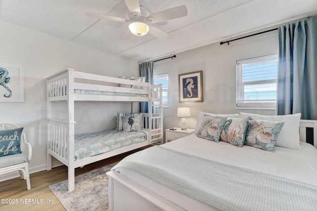 3350 S Fletcher Ave Unit C5, Fernandina Beach, FL 32034 - bedroom with wood finished floors, ceiling fan, and a textured ceiling