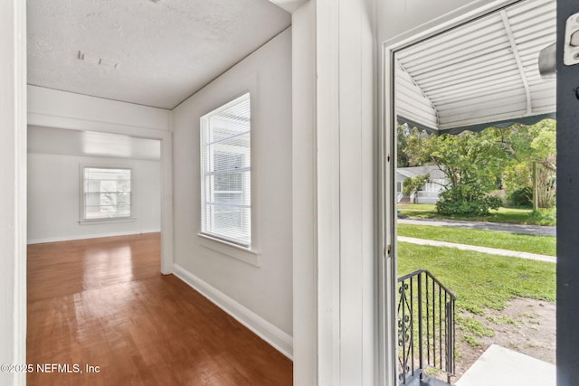 4723 Sunderland Rd, Jacksonville, FL 32210 - hallway featuring wood finished floors and a textured ceiling