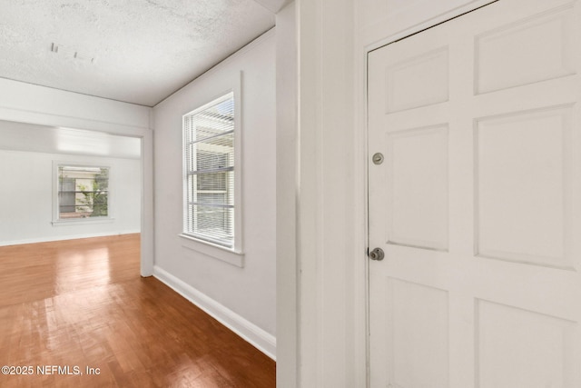 4723 Sunderland Rd, Jacksonville, FL 32210 - hall with wood finished floors and a textured ceiling