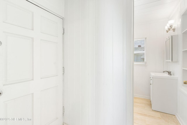 4723 Sunderland Rd, Jacksonville, FL 32210 - bathroom featuring vanity, wood finished floors, and crown molding