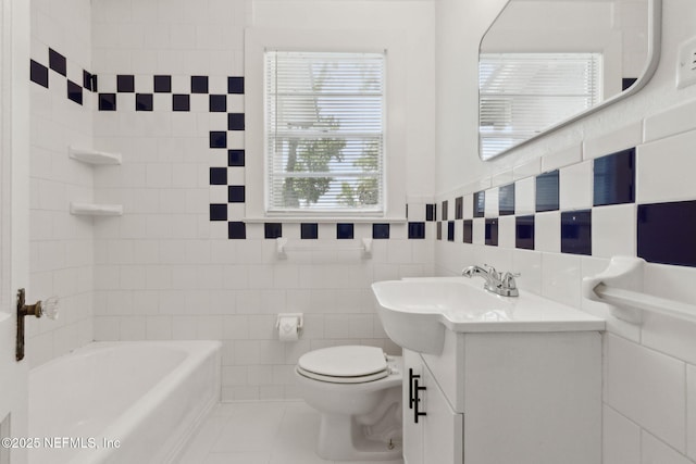 4723 Sunderland Rd, Jacksonville, FL 32210 - full bathroom with vanity, tile walls, tile patterned flooring, and shower / bath combination