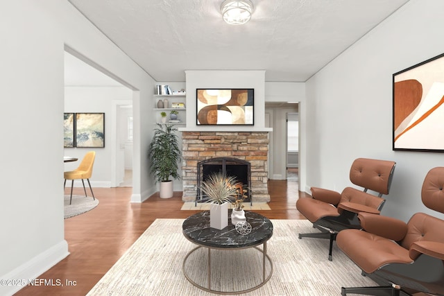 4723 Sunderland Rd, Jacksonville, FL 32210 - living room featuring wood finished floors and a fireplace