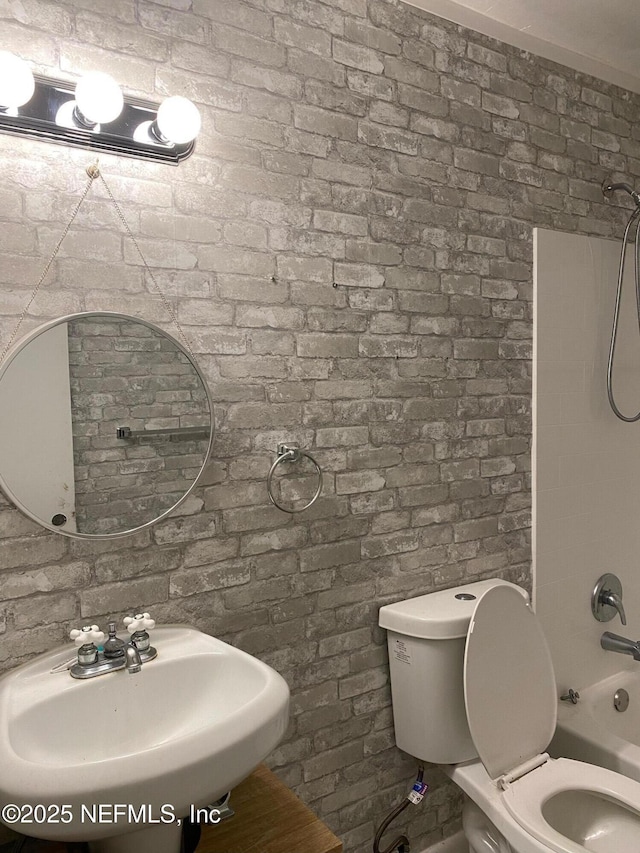 731 Oaks Field Rd Unit K2-1, Jacksonville, FL 32211 - full bathroom featuring bathing tub / shower combination and brick wall