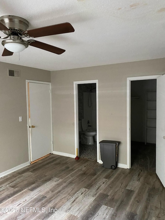 731 Oaks Field Rd Unit K2-1, Jacksonville, FL 32211 - unfurnished bedroom with a closet, wood finished floors, a walk in closet, ensuite bath, and a ceiling fan