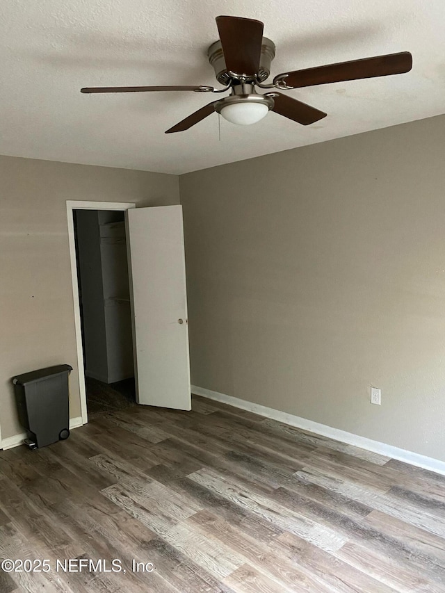 731 Oaks Field Rd Unit K2-1, Jacksonville, FL 32211 - unfurnished bedroom with wood finished floors, a closet, ceiling fan, and a textured ceiling
