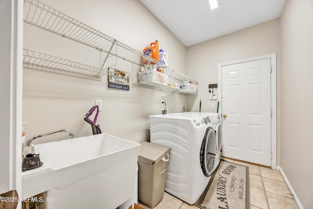 2502 Willow Creek Dr, Fleming Island, FL 32003 - laundry area featuring washing machine and dryer and baseboards