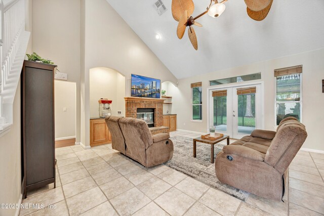2502 Willow Creek Dr, Fleming Island, FL 32003 - living area featuring a ceiling fan, high vaulted ceiling, light tile patterned floors, french doors, and plenty of natural light