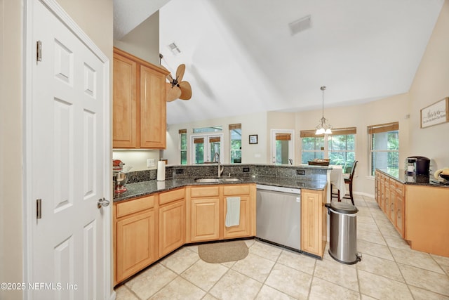 2502 Willow Creek Dr, Fleming Island, FL 32003 - kitchen featuring dishwasher, a peninsula, light tile patterned flooring, light brown cabinets, and vaulted ceiling
