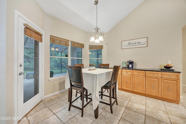 2502 Willow Creek Dr, Fleming Island, FL 32003 - dining space featuring a chandelier and high vaulted ceiling
