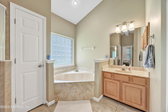 2502 Willow Creek Dr, Fleming Island, FL 32003 - full bath with vanity, a bath, vaulted ceiling, a shower stall, and tile patterned flooring