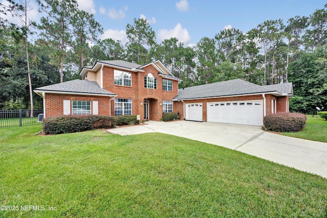 2502 Willow Creek Dr, Fleming Island, FL 32003 - view of front of home with brick siding, concrete driveway, an attached garage, and view of scattered trees
