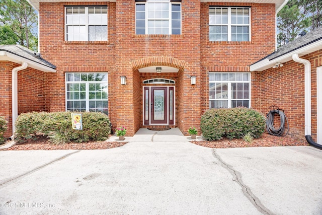 2502 Willow Creek Dr, Fleming Island, FL 32003 - view of exterior entry featuring brick siding