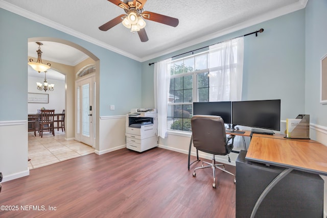 2502 Willow Creek Dr, Fleming Island, FL 32003 - home office with wood finished floors, a chandelier, arched walkways, ceiling fan, and ornamental molding