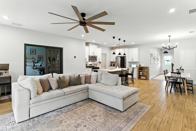 133 Wambaw Dr, Saint Johns, FL 32259 - living area featuring ceiling fan, light wood finished floors, recessed lighting, and a chandelier