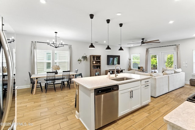 133 Wambaw Dr, Saint Johns, FL 32259 - kitchen featuring stainless steel dishwasher, light wood finished floors, ceiling fan, recessed lighting, and white cabinets