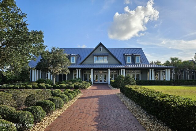 133 Wambaw Dr, Saint Johns, FL 32259 - view of front facade with french doors, a standing seam roof, and a metal roof