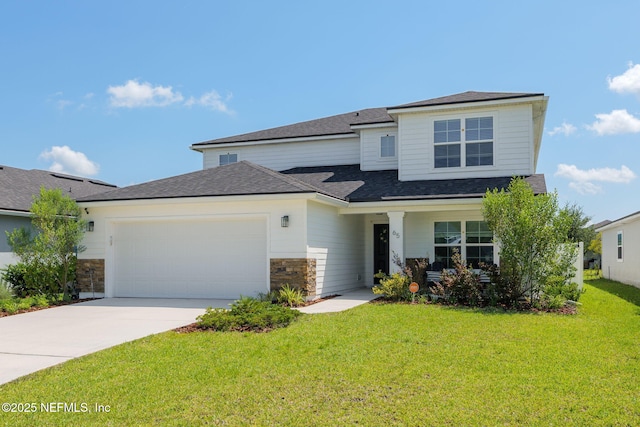 65 Birchfield Ln, Saint Augustine, FL 32092 - view of front of house featuring a garage, driveway, a front yard, stone siding, and roof with shingles