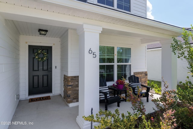 65 Birchfield Ln, Saint Augustine, FL 32092 - property entrance featuring covered porch and stone siding