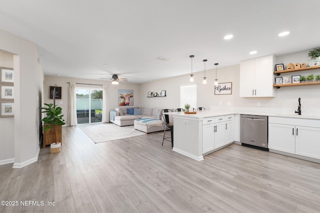 65 Birchfield Ln, Saint Augustine, FL 32092 - kitchen with dishwasher, open floor plan, a peninsula, white cabinets, and recessed lighting