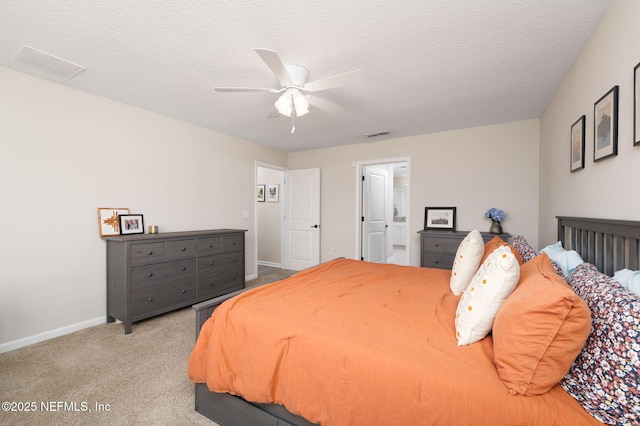 65 Birchfield Ln, Saint Augustine, FL 32092 - bedroom with carpet, ensuite bath, a ceiling fan, and a textured ceiling