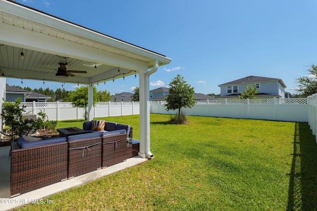 65 Birchfield Ln, Saint Augustine, FL 32092 - fenced backyard featuring a ceiling fan and outdoor lounge area