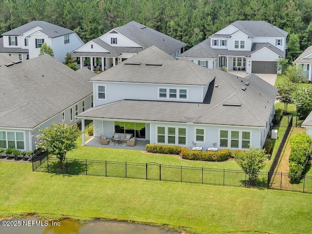 246 Glenneyre Cir, Saint Augustine, FL 32092 - back of property with a residential view, a patio area, a forest view, and a fenced backyard
