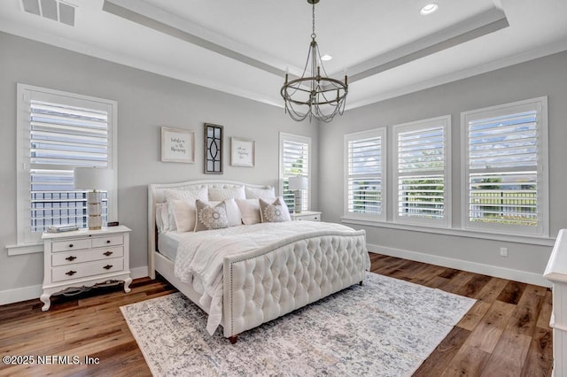 246 Glenneyre Cir, Saint Augustine, FL 32092 - bedroom with a tray ceiling, a chandelier, recessed lighting, wood finished floors, and ornamental molding