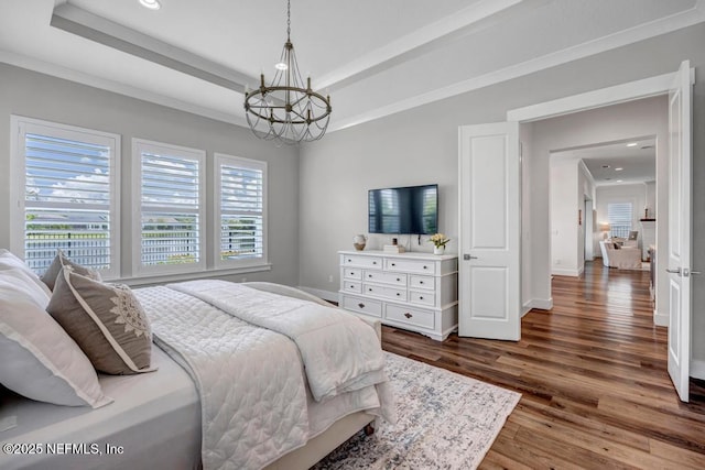 246 Glenneyre Cir, Saint Augustine, FL 32092 - bedroom with a chandelier, wood finished floors, recessed lighting, and a tray ceiling