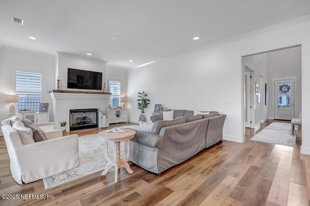 246 Glenneyre Cir, Saint Augustine, FL 32092 - living area featuring ornamental molding, wood finished floors, a fireplace, and recessed lighting