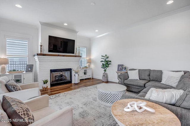 246 Glenneyre Cir, Saint Augustine, FL 32092 - living area featuring ornamental molding, wood finished floors, a brick fireplace, and recessed lighting