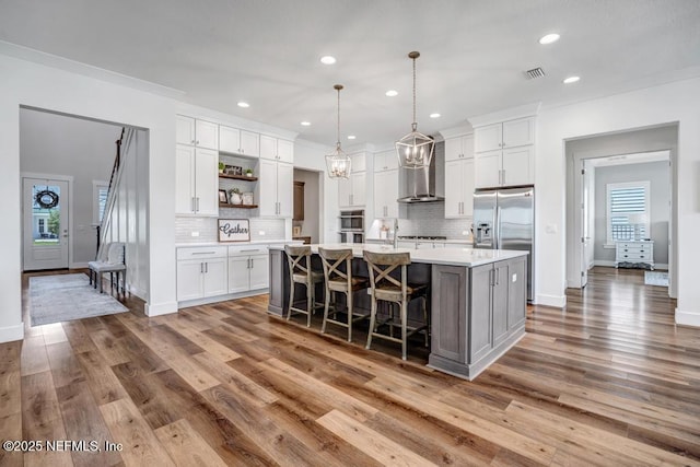 246 Glenneyre Cir, Saint Augustine, FL 32092 - kitchen featuring open shelves, appliances with stainless steel finishes, light countertops, white cabinetry, and backsplash