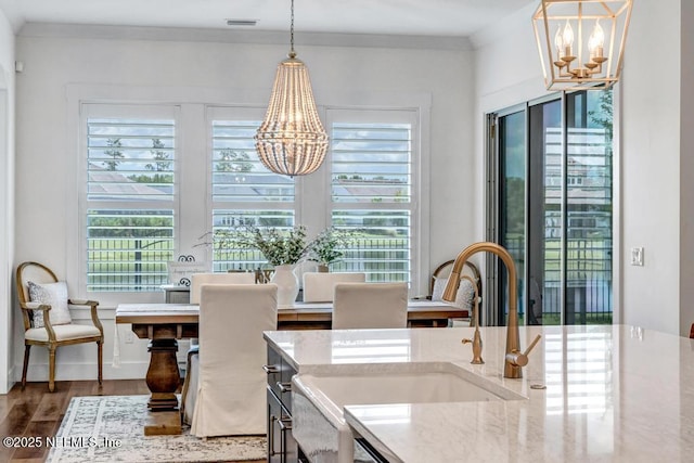 246 Glenneyre Cir, Saint Augustine, FL 32092 - dining room with a chandelier and wood finished floors