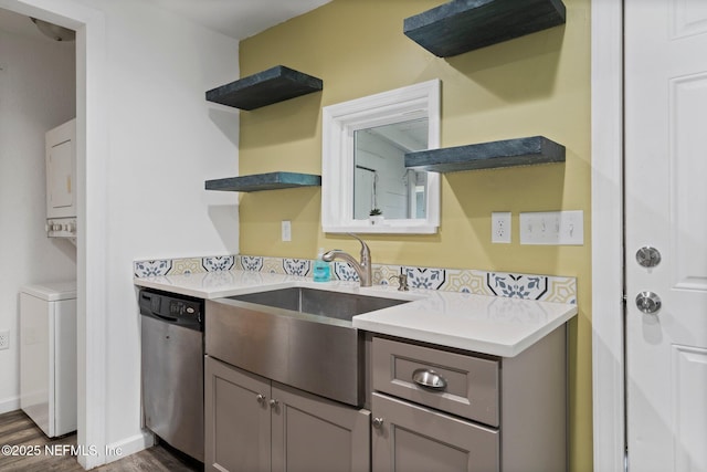 5834 Harris Ave, Jacksonville, FL 32211 - kitchen with dishwasher, open shelves, stacked washer and clothes dryer, dark wood-style flooring, and gray cabinets