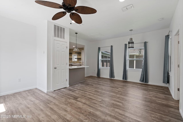 5834 Harris Ave, Jacksonville, FL 32211 - unfurnished living room featuring wood finished floors and ceiling fan
