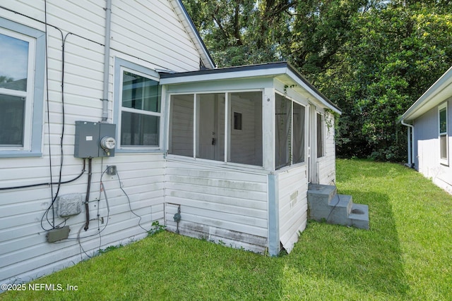 5834 Harris Ave, Jacksonville, FL 32211 - view of home's exterior featuring a sunroom and a yard