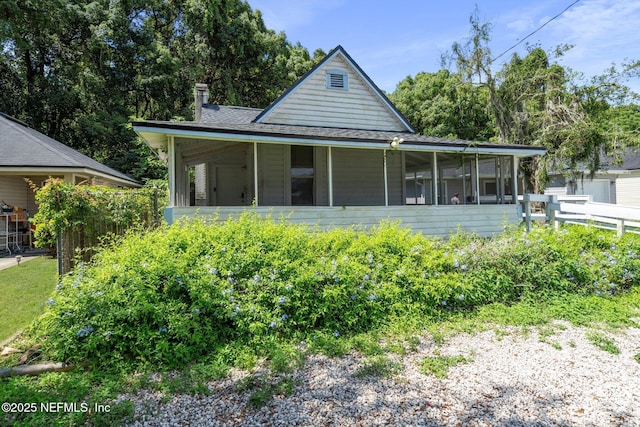 5834 Harris Ave, Jacksonville, FL 32211 - view of front of house with a sunroom and a shingled roof