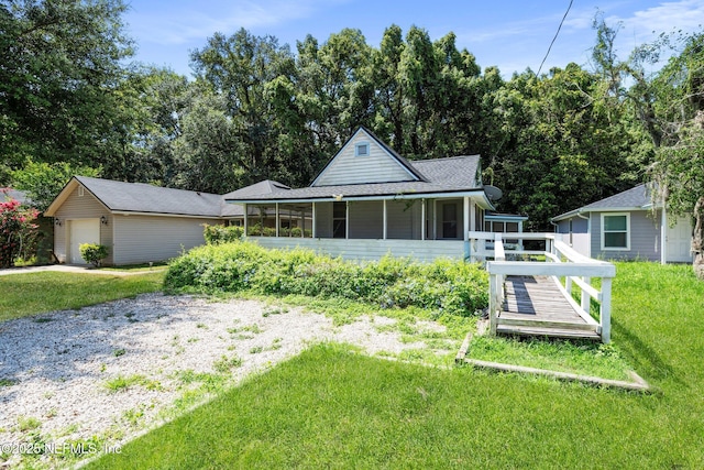 5834 Harris Ave, Jacksonville, FL 32211 - view of front of home featuring a front yard, a garage, a sunroom, a shingled roof, and a wooden deck