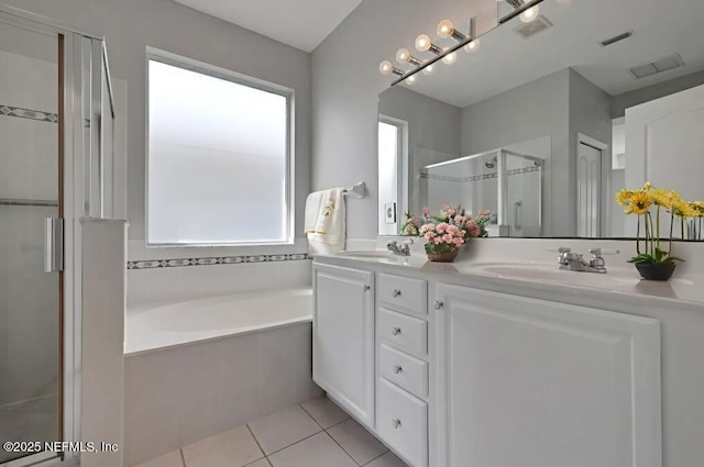 644 Casa Fuerta Ln, Saint Augustine, FL 32080 - full bathroom with a stall shower, a garden tub, double vanity, and tile patterned flooring