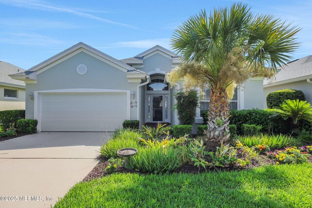 644 Casa Fuerta Ln, Saint Augustine, FL 32080 - view of front of house featuring stucco siding, concrete driveway, and a garage