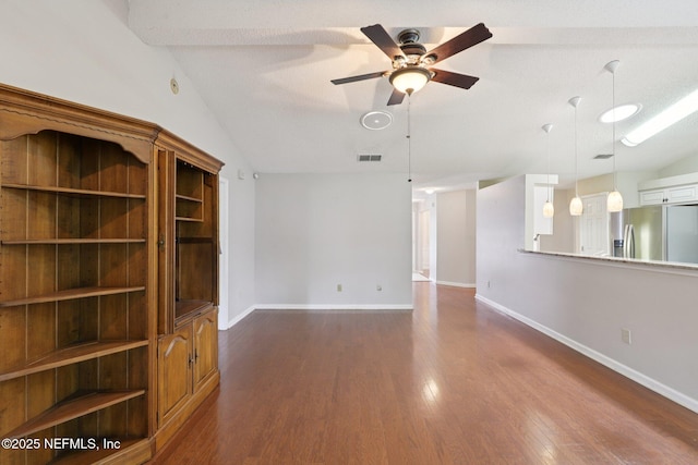 1835 Harbor Island Dr, Fleming Island, FL 32003 - unfurnished living room with ceiling fan, lofted ceiling, and dark wood-style flooring