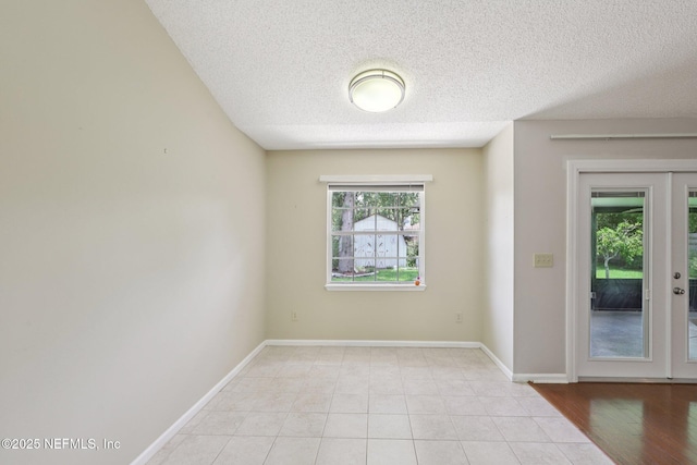 1835 Harbor Island Dr, Fleming Island, FL 32003 - spare room featuring a textured ceiling and light tile patterned floors