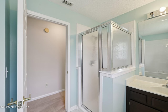 1835 Harbor Island Dr, Fleming Island, FL 32003 - bathroom featuring a stall shower, vanity, and a textured ceiling