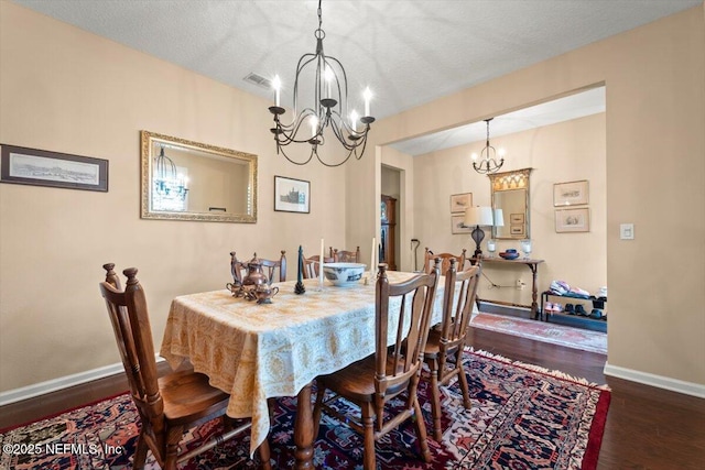 141 Mediterra Ave, Ponte Vedra, FL 32081 - dining space with a chandelier, wood finished floors, and a textured ceiling